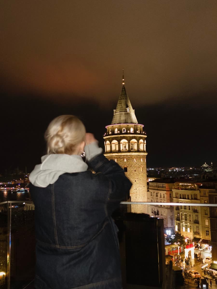Kate photographing Galata Tower at night